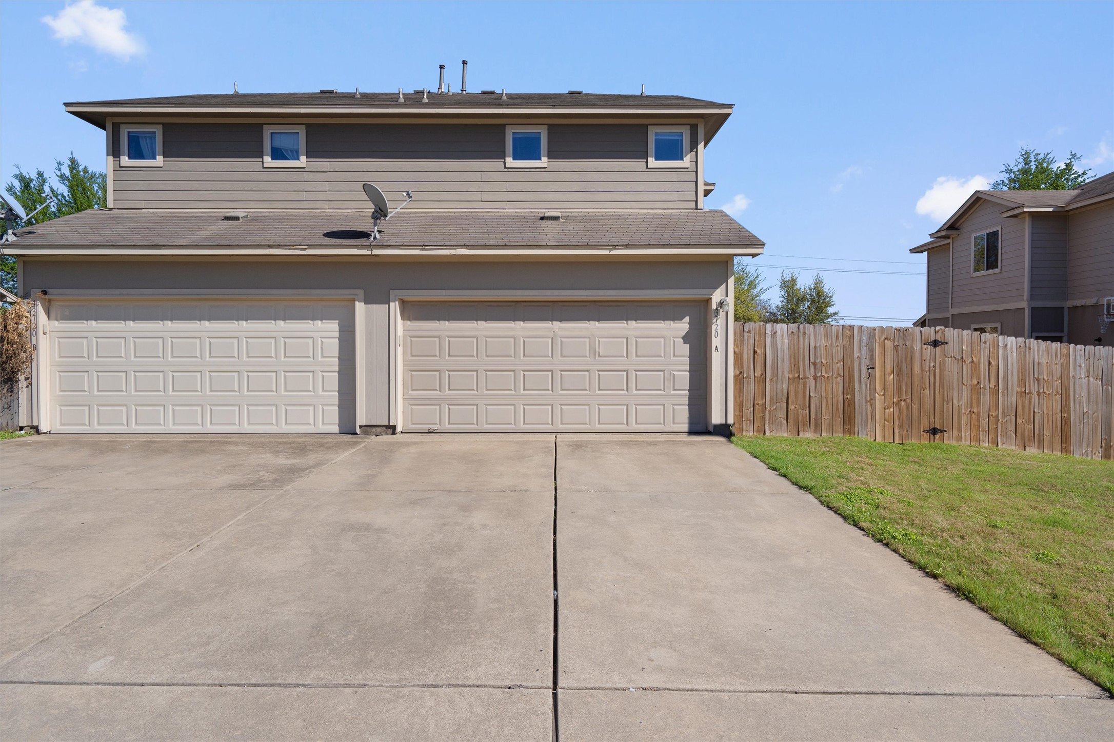 13720 Harris Ridge Boulevard, Unit A Pflugerville, TX 78660 - Photo 25 of 27 Garage with driveway