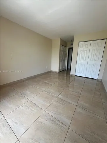 an empty room with a bathroom