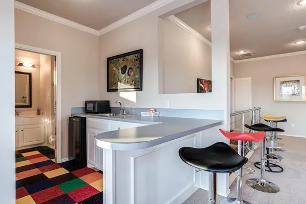 a room with a couch and musical instruments