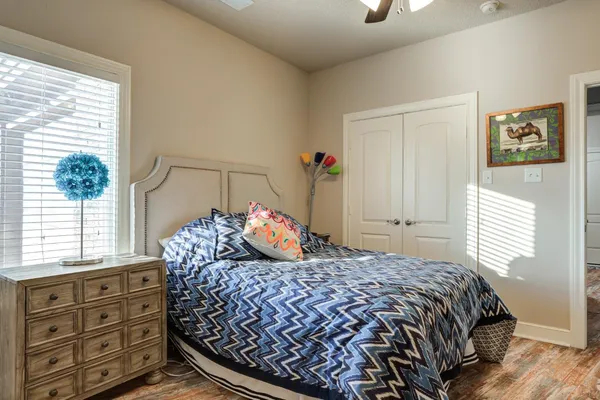 a bedroom with a bed and a window