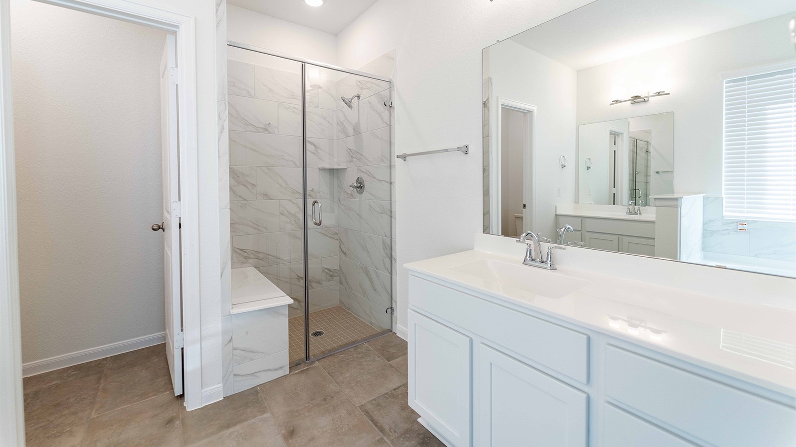 251 Grey Leaf Road Buda, TX 78610 - Photo 10 of 17 Bathroom with vanity and a marble finish shower