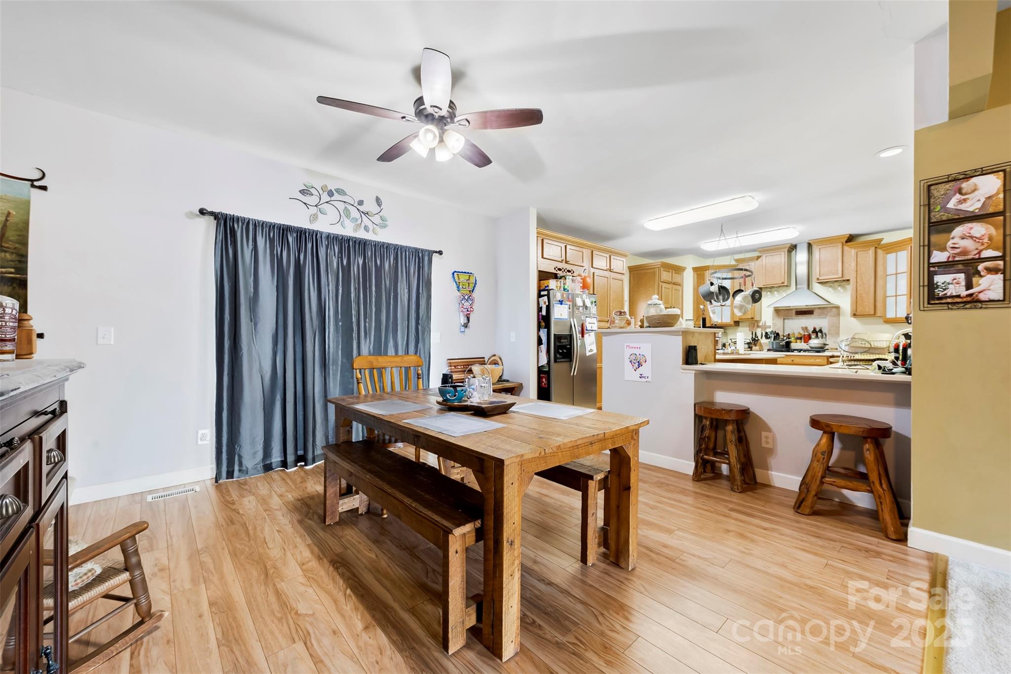 1581 Rhyne Road Dallas, NC 28034 - Photo 11 of 25 a view of a dining room with furniture window and wooden floor