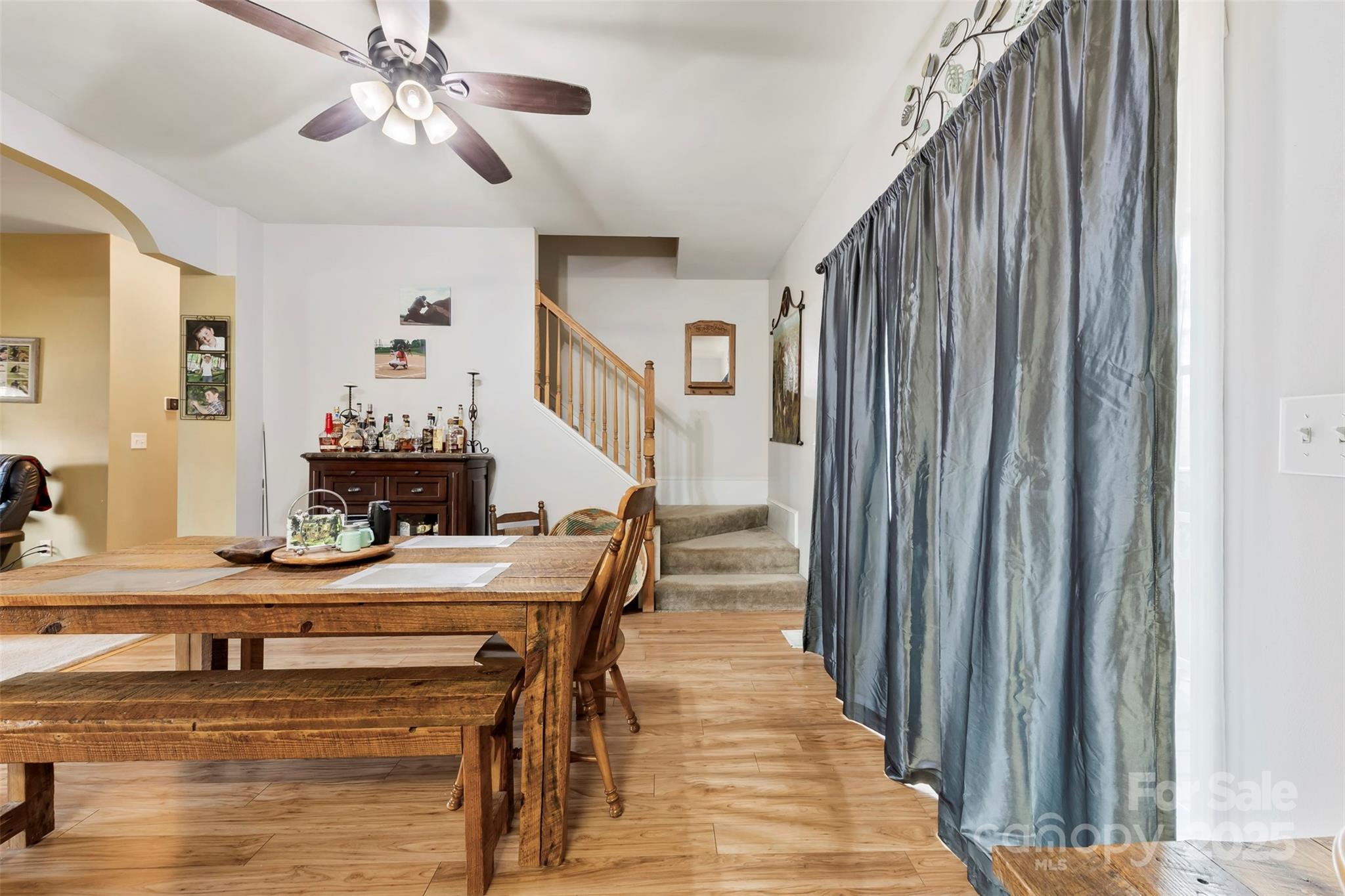 1581 Rhyne Road Dallas, NC 28034 - Photo 13 of 25 a view of a dining room with furniture and a chandelier