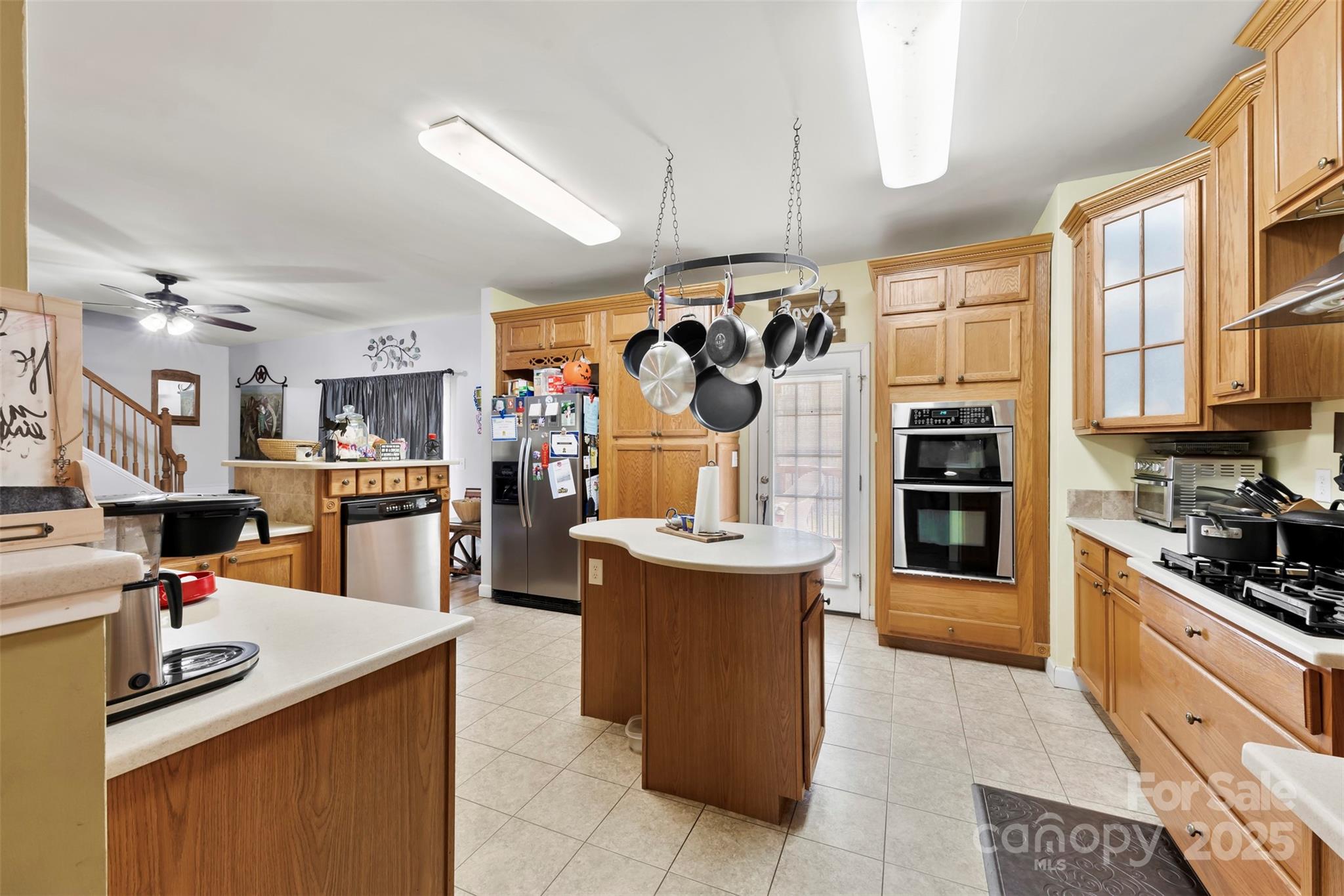 1581 Rhyne Road Dallas, NC 28034 - Photo 14 of 25 a kitchen with stainless steel appliances kitchen island granite countertop a stove and a sink