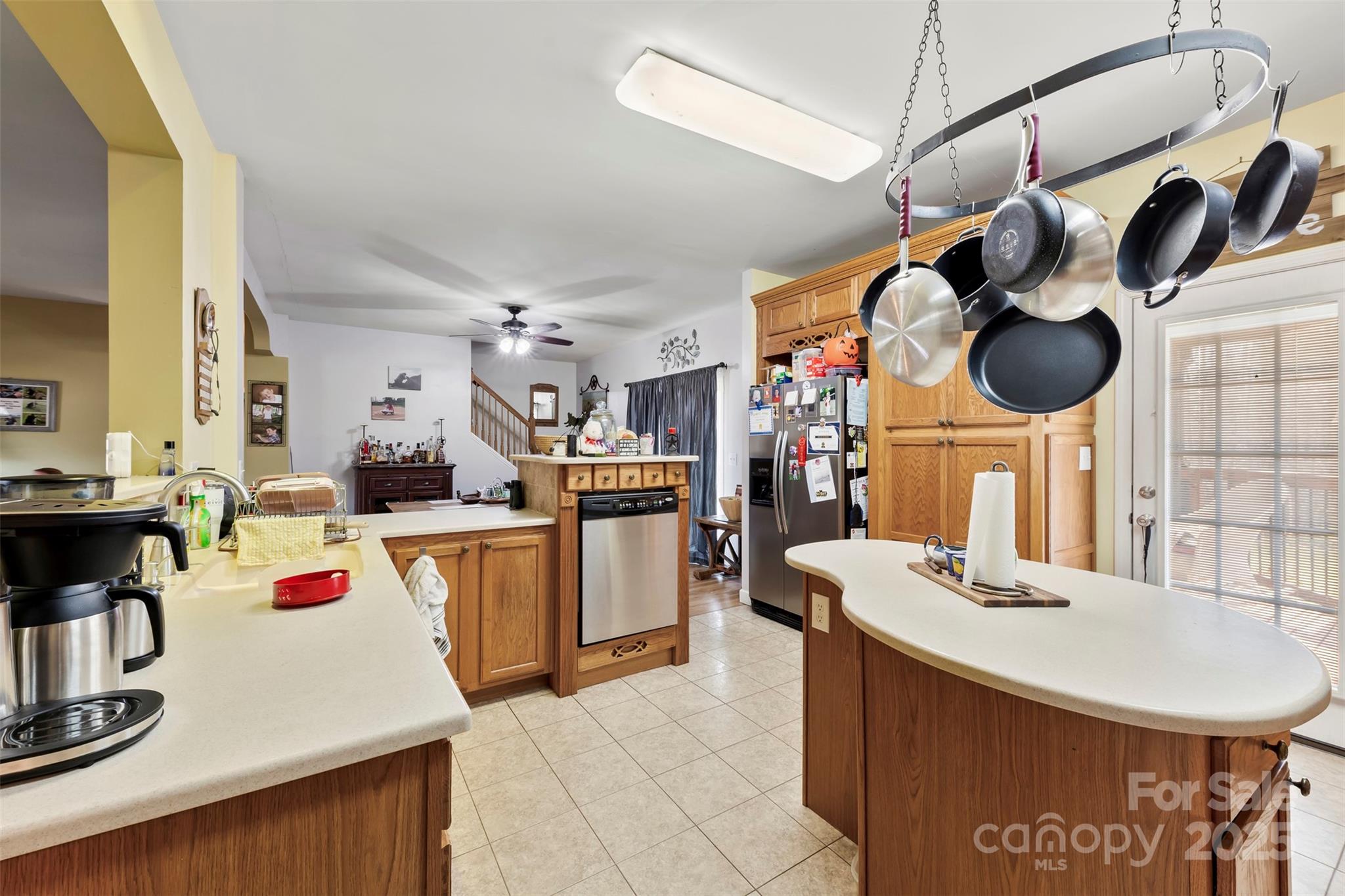 1581 Rhyne Road Dallas, NC 28034 - Photo 15 of 25 a kitchen with a sink a stove and chairs