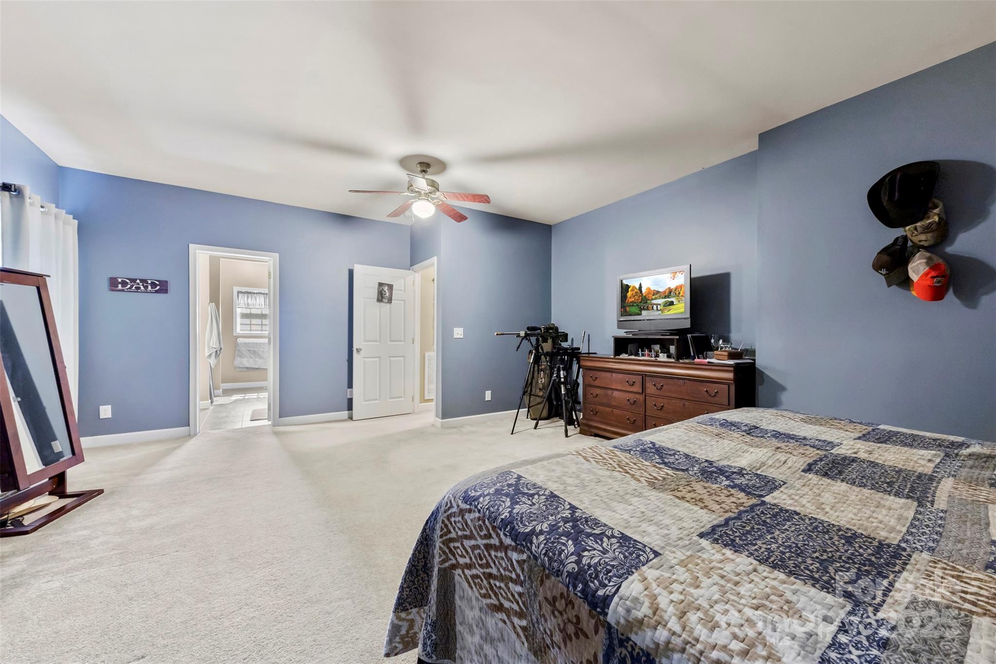 1581 Rhyne Road Dallas, NC 28034 - Photo 17 of 25 a bedroom with a bed and a flat screen tv