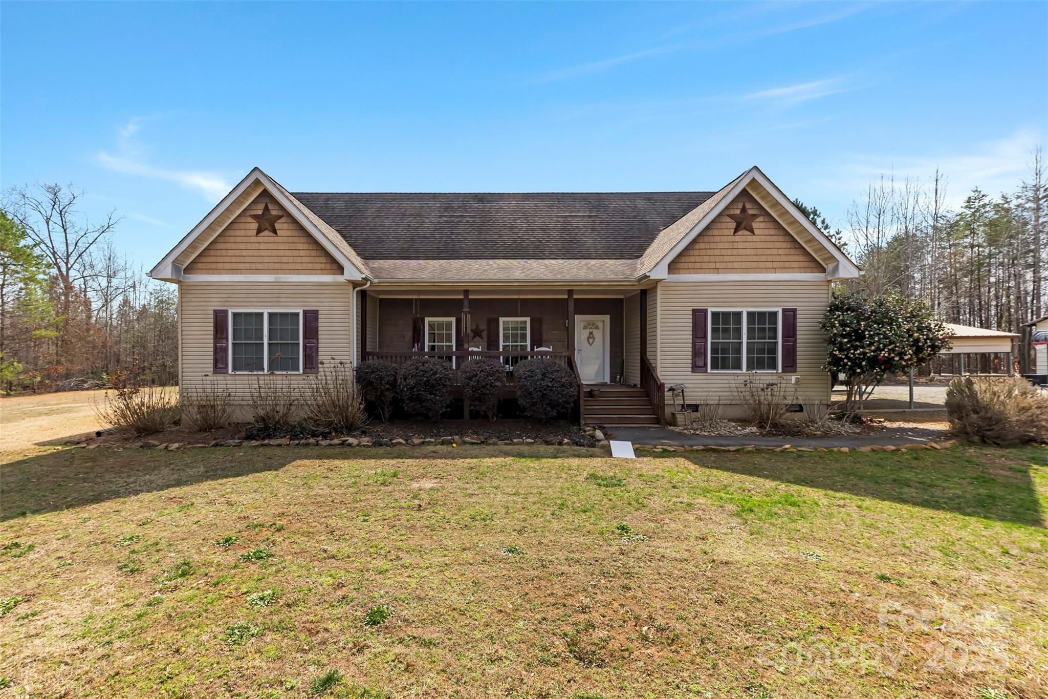 1581 Rhyne Road Dallas, NC 28034 - Photo 7 of 25 a front view of a house with a yard