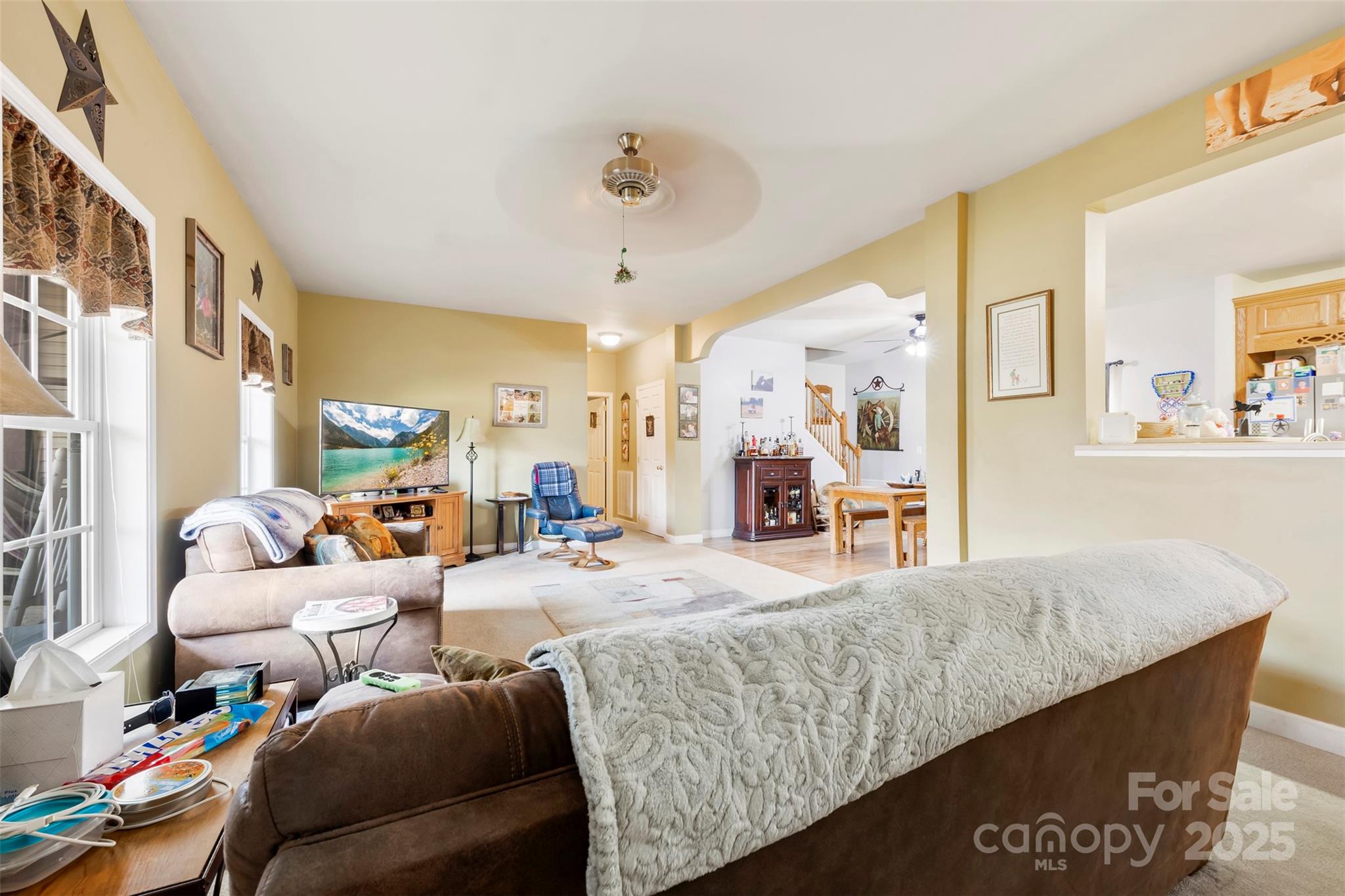 1581 Rhyne Road Dallas, NC 28034 - Photo 8 of 25 a living room with furniture and a chandelier