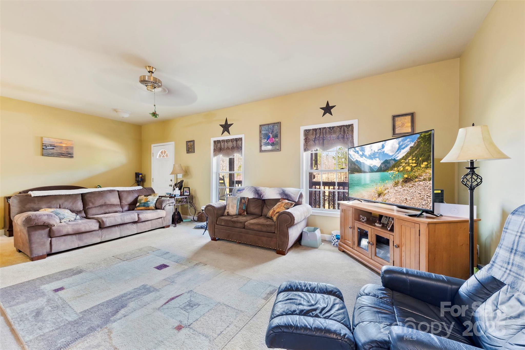 1581 Rhyne Road Dallas, NC 28034 - Photo 10 of 25 a living room with furniture and a flat screen tv