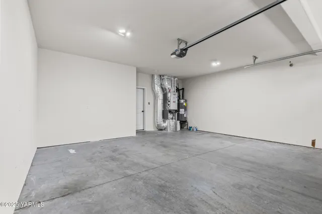 an empty room with closet and a ceiling fan