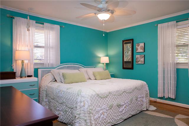 487 Hogan Road Nashville, TN 37220 - Photo 12 of 17 Bedroom on the main level has hardwood floors and large closet.
