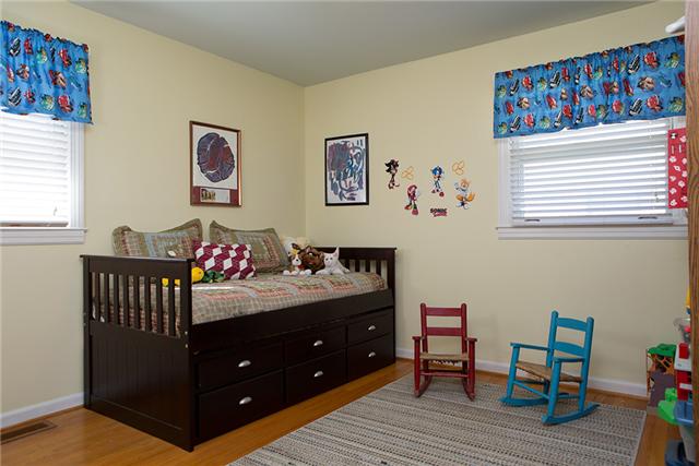 487 Hogan Road Nashville, TN 37220 - Photo 13 of 17 Bedroom on the main level has hardwood floors.
