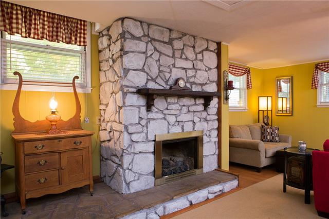 487 Hogan Road Nashville, TN 37220 - Photo 7 of 17 This added space has a gas fireplace, good light, and access to the half bath.