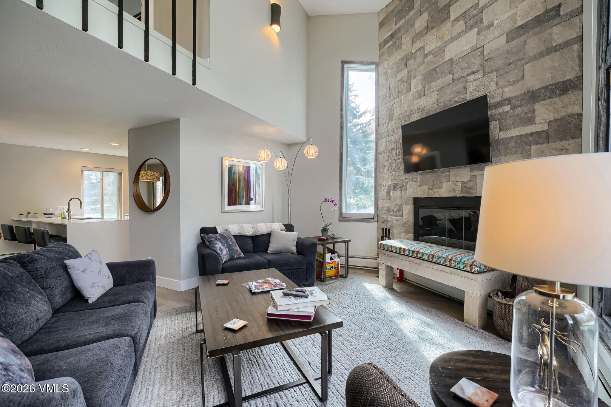 142 Eagle Drive, Unit C1 Avon, CO 81620 - Photo 2 of 20 a living room with furniture and a fireplace