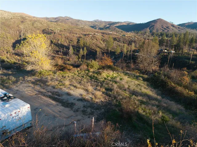a view of a town with mountains in the background
