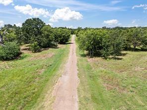 751 South Wills Point Wills Point, TX 75169 - Photo 2 of 12 a view of a pathway both side of yard