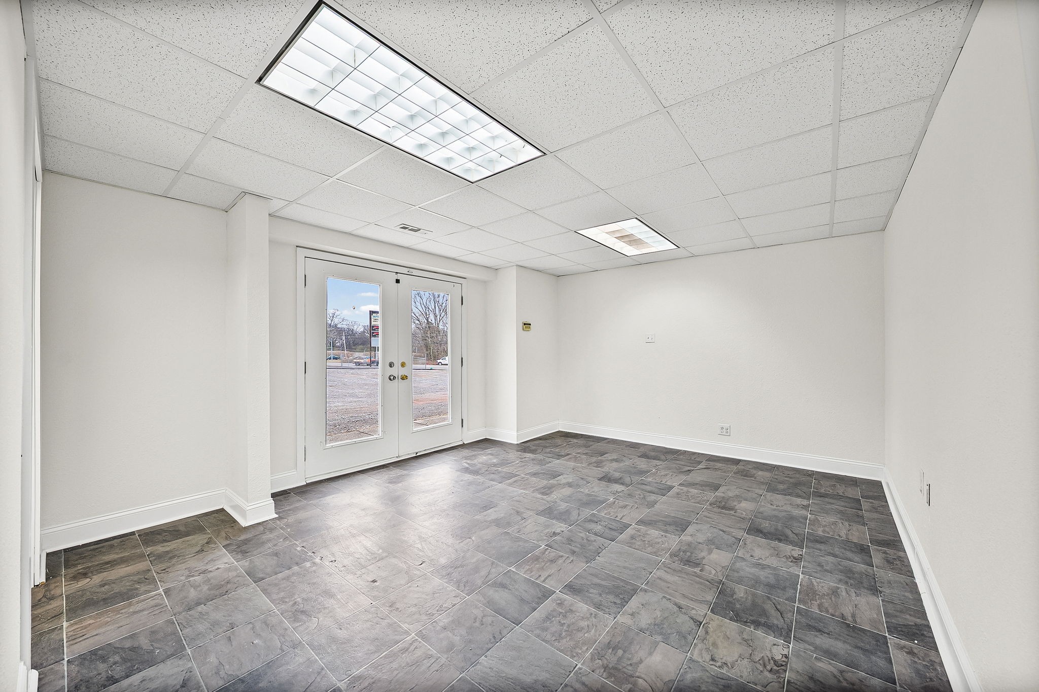 1379 C Ashland City Road Clarksville, TN 37040 - Photo 4 of 12 a view of an empty room with a window