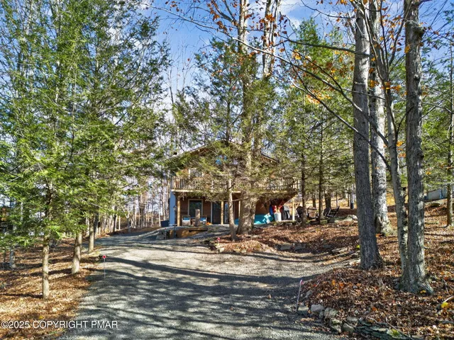 a front view of a house with yard and seating area