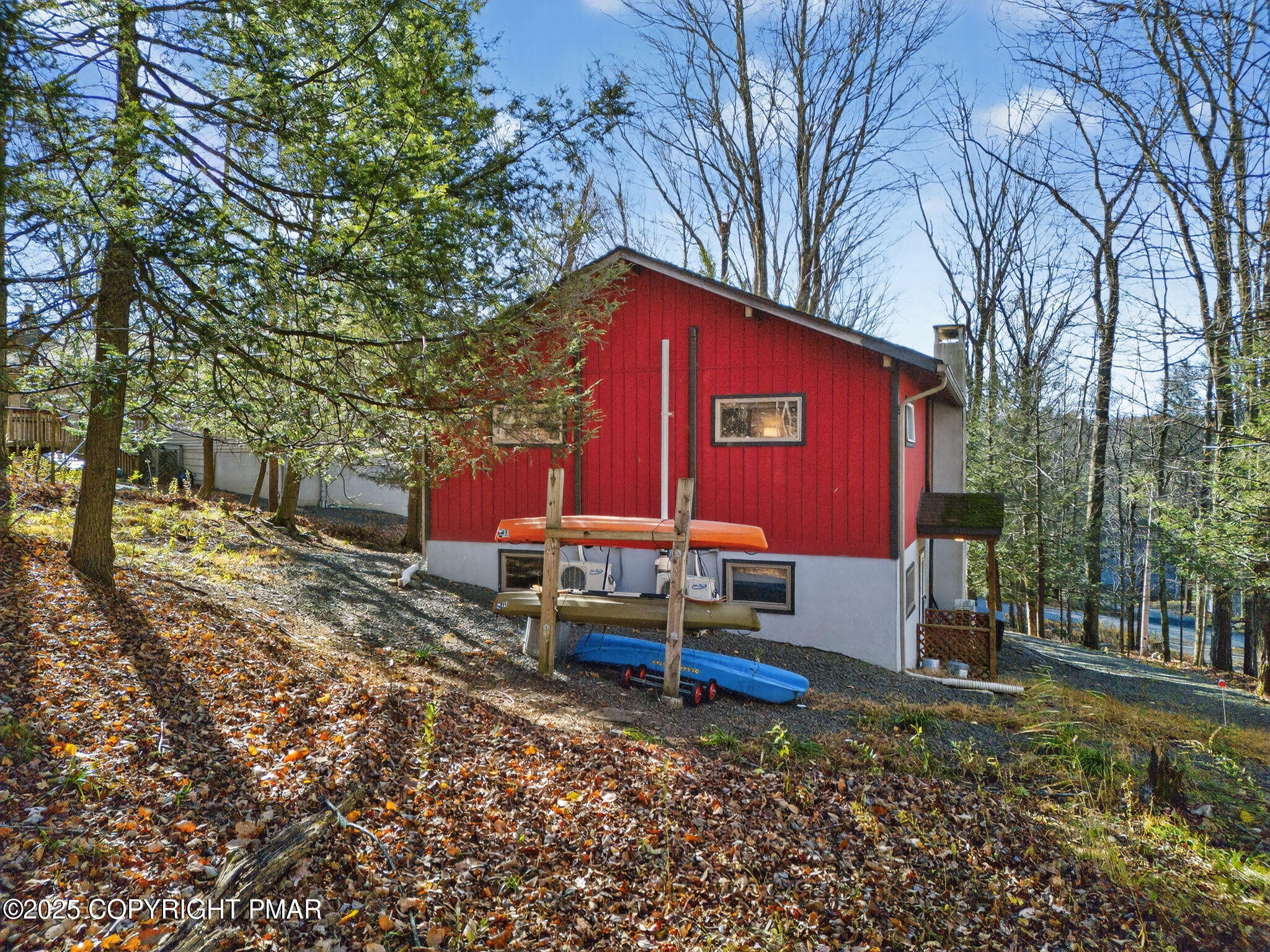 134 Deerfield Road Lake Ariel, PA 18436 - Photo 16 of 56 a backyard of a house with barbeque oven table and chairs