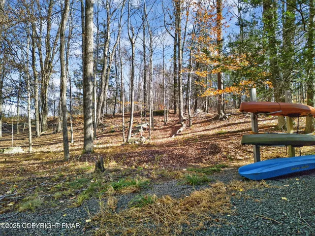 an aerial view of house with yard and mountain view