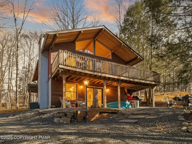 a view of a building with a umbrellas on a street