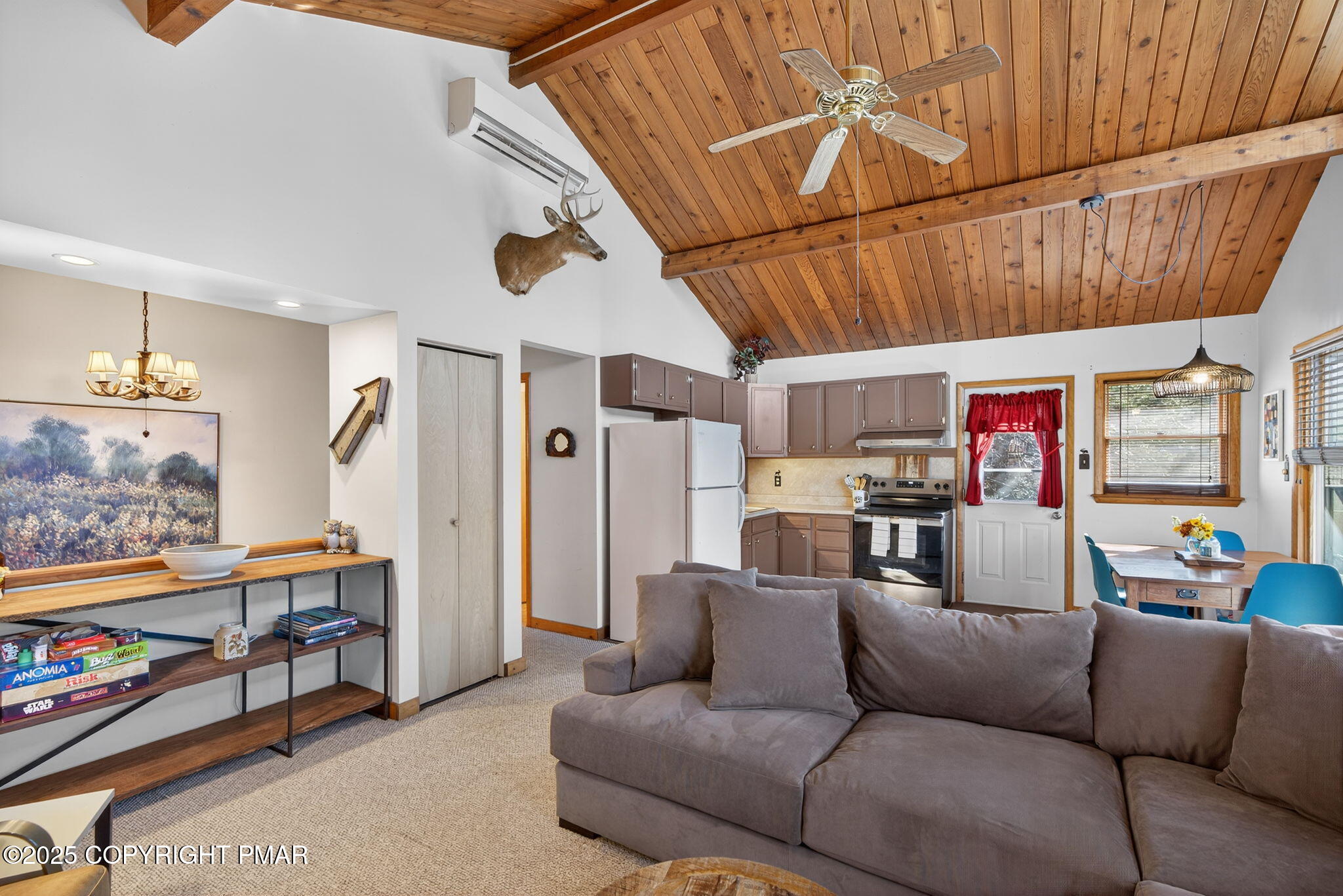 134 Deerfield Road Lake Ariel, PA 18436 - Photo 32 of 56 a living room with furniture a ceiling fan and a rug