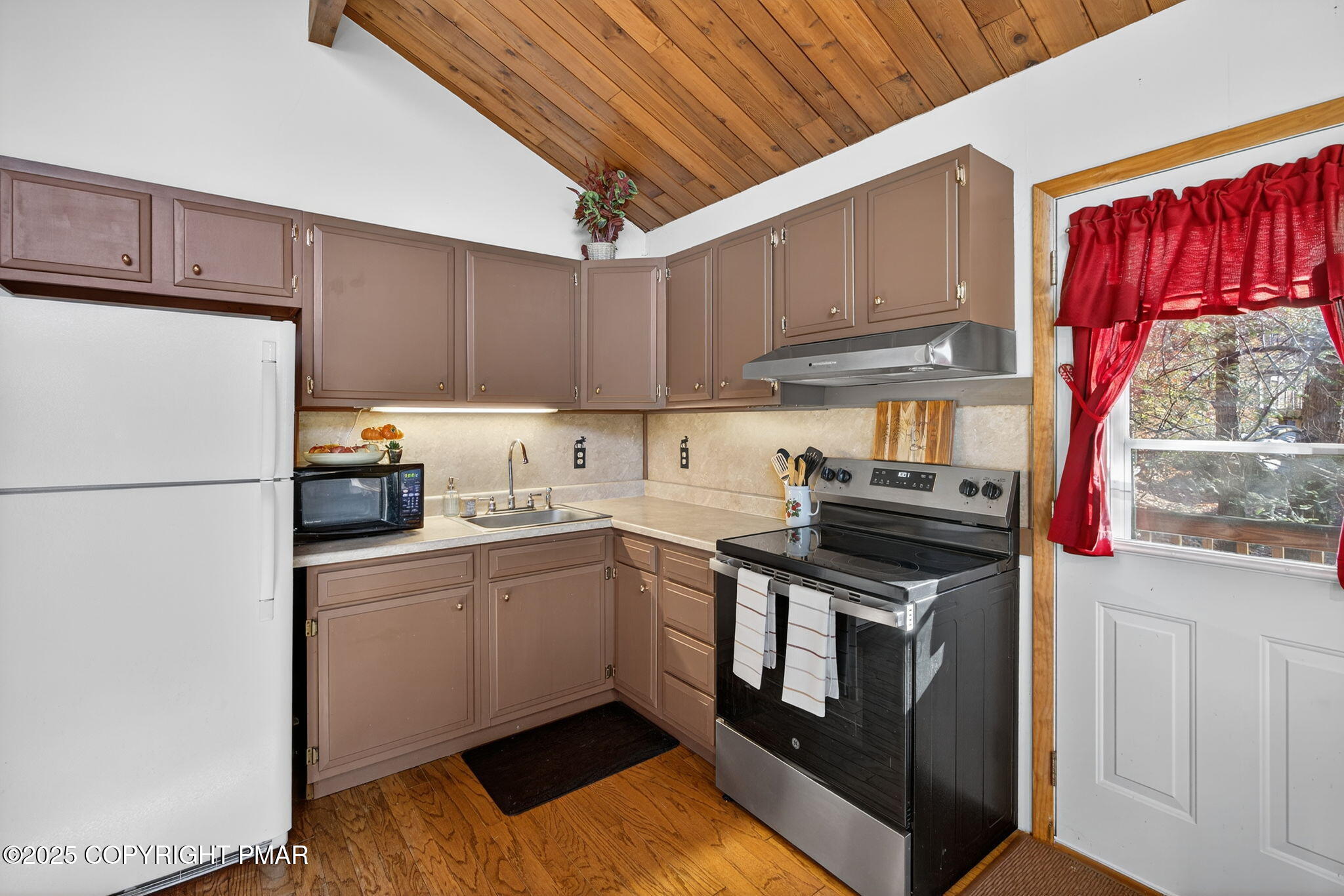 134 Deerfield Road Lake Ariel, PA 18436 - Photo 38 of 56 a kitchen with stainless steel appliances granite countertop a refrigerator sink and cabinets