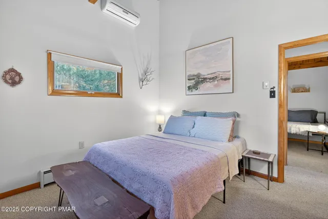 a living room with furniture a ceiling fan and a window