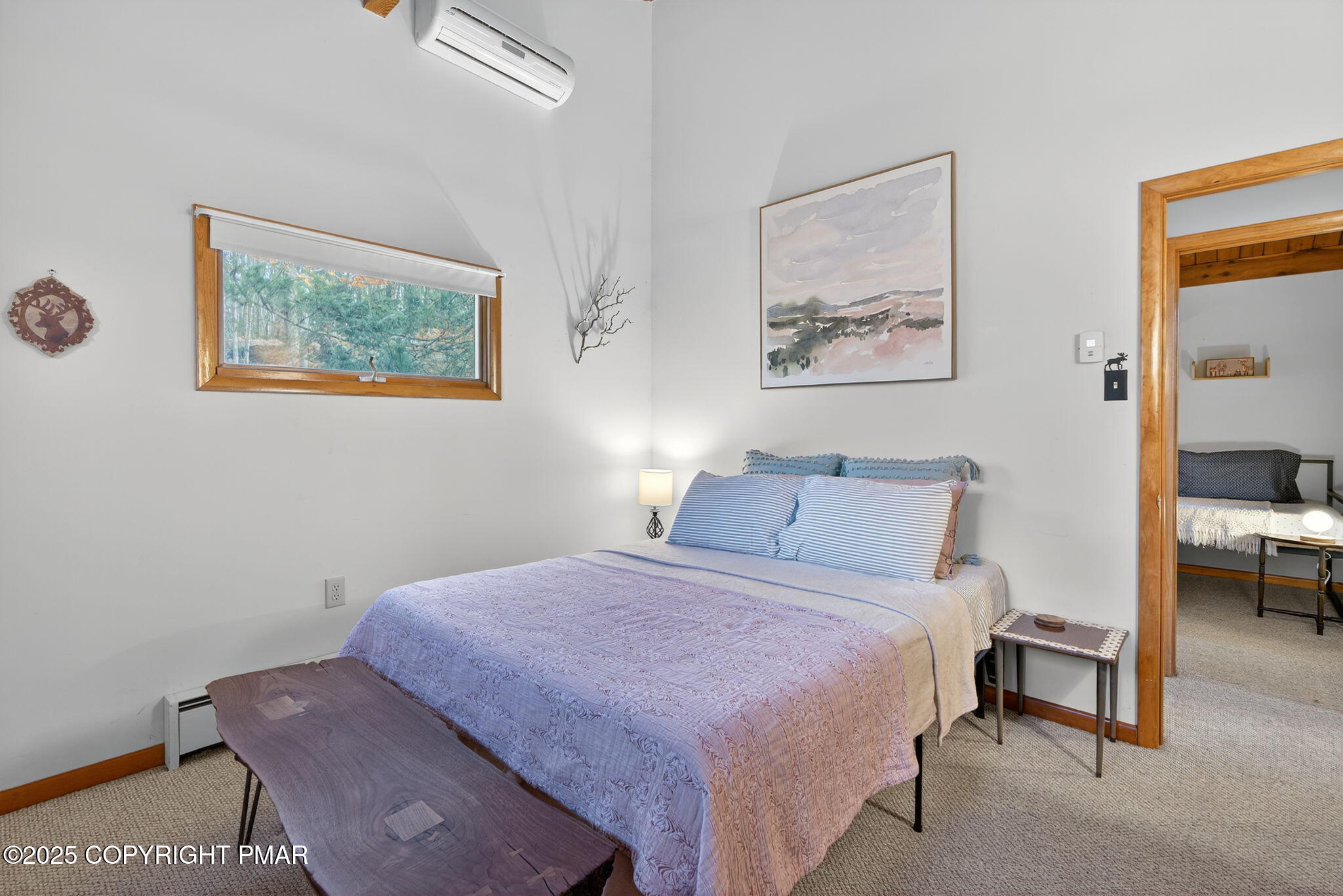 134 Deerfield Road Lake Ariel, PA 18436 - Photo 42 of 56 a bedroom with a bed and a painting on the wall