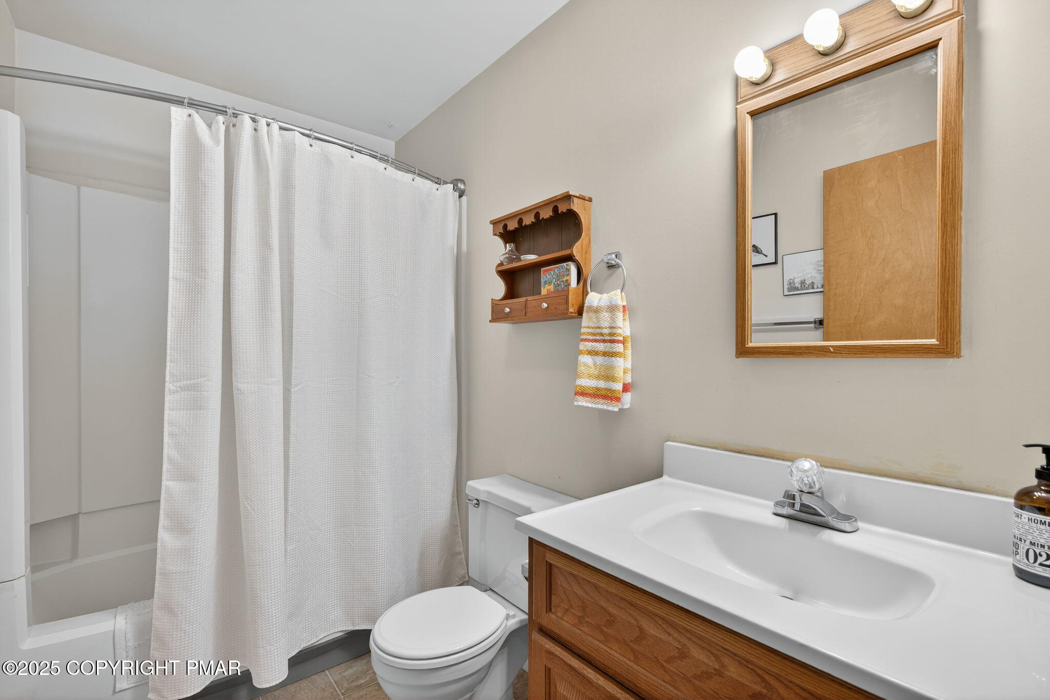 134 Deerfield Road Lake Ariel, PA 18436 - Photo 44 of 56 a bathroom with a sink a toilet and shower curtain