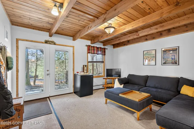 a living room with furniture and a clock