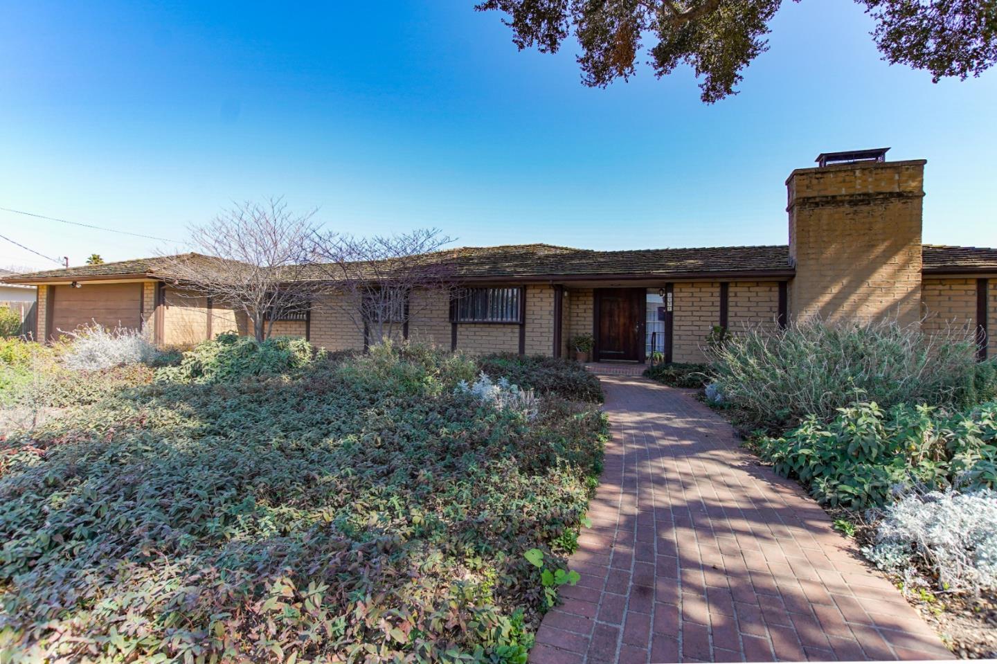 1521 Cienega Road Hollister, CA 95023 - Photo 1 of 56 a front view of a house with garden