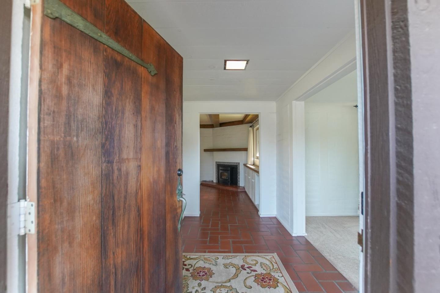 1521 Cienega Road Hollister, CA 95023 - Photo 11 of 56 a view of a hallway with wooden floor and furniture