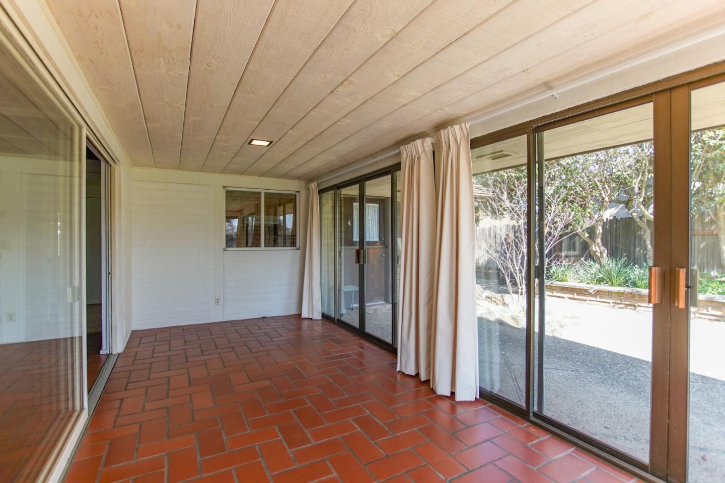 1521 Cienega Road Hollister, CA 95023 - Photo 16 of 56 a big room with wooden floor and windows