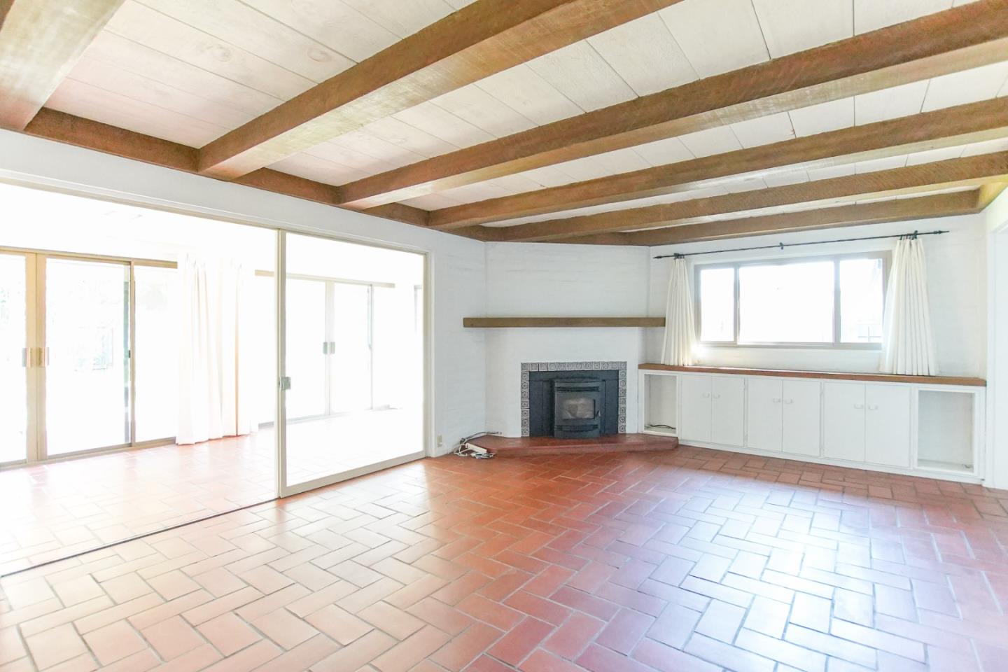 1521 Cienega Road Hollister, CA 95023 - Photo 18 of 56 a view of an empty room with a fireplace
