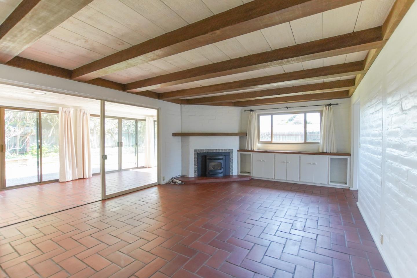 1521 Cienega Road Hollister, CA 95023 - Photo 22 of 56 a view of an empty room with window and fire place
