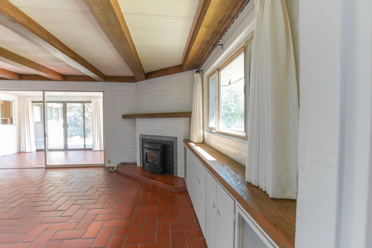 1521 Cienega Road Hollister, CA 95023 - Photo 24 of 56 a view of an empty room with wooden floor and a window