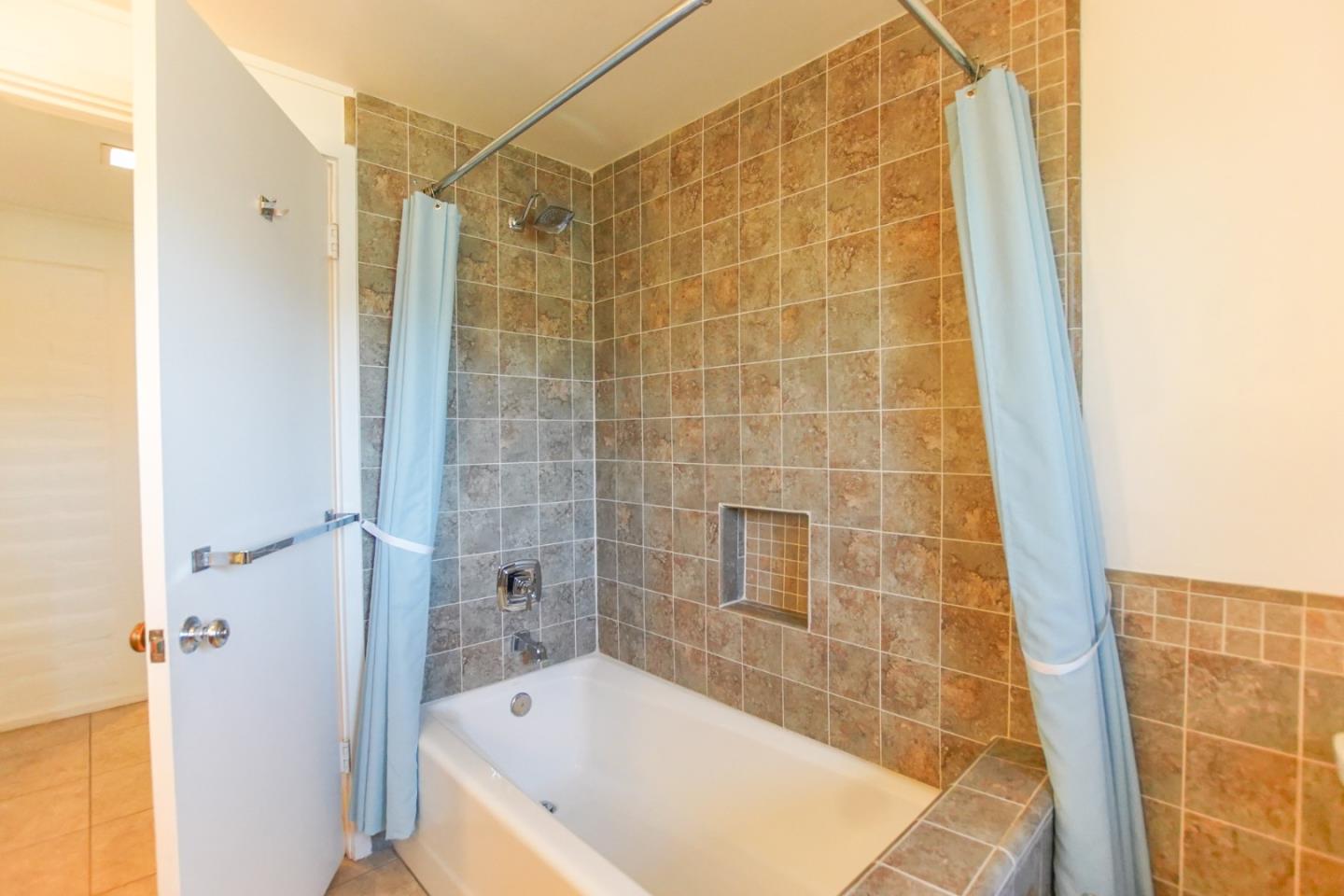 1521 Cienega Road Hollister, CA 95023 - Photo 29 of 56 a bathroom with a bathtub and a shower