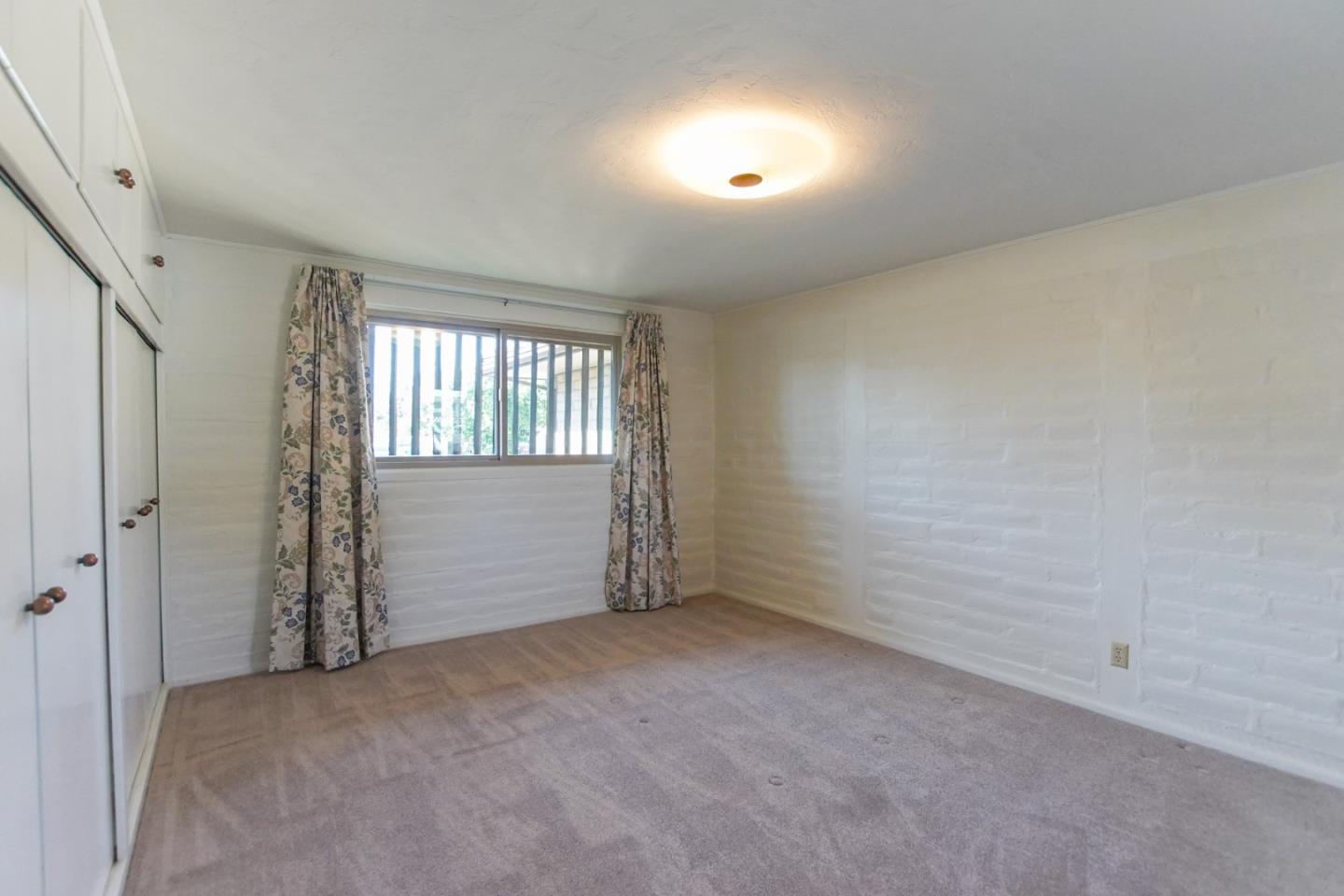1521 Cienega Road Hollister, CA 95023 - Photo 30 of 56 an empty room with windows