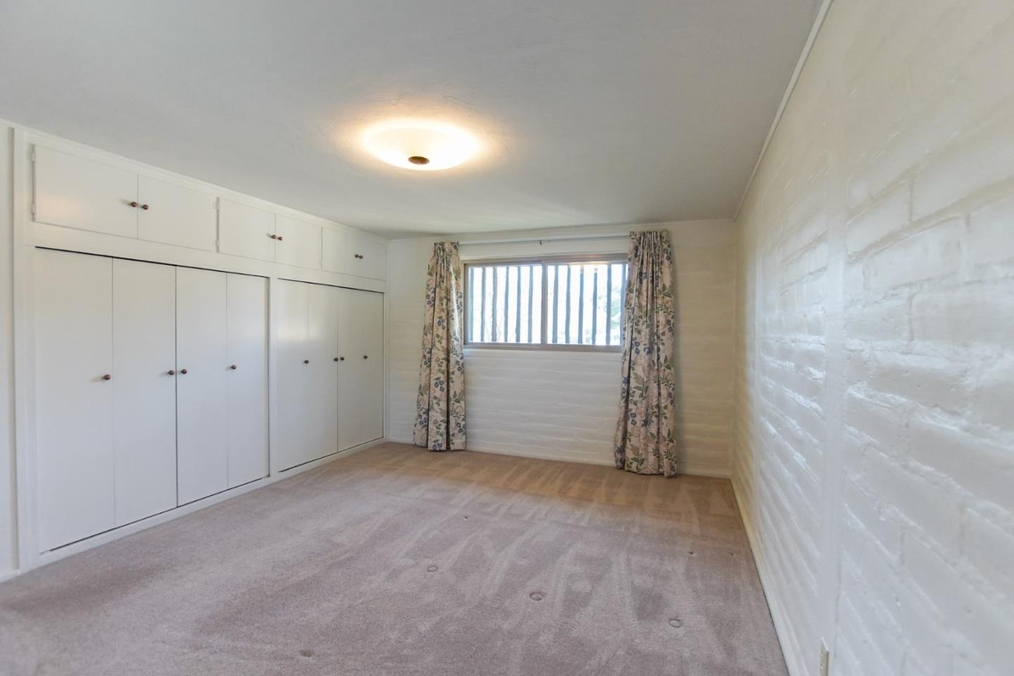 1521 Cienega Road Hollister, CA 95023 - Photo 31 of 56 a view of an empty room with a window