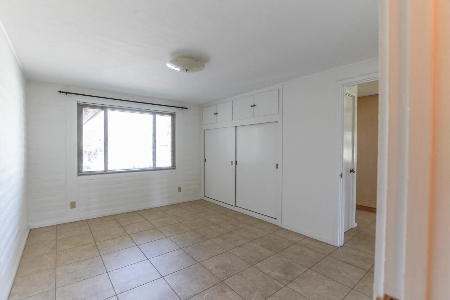 1521 Cienega Road Hollister, CA 95023 - Photo 32 of 56 a view of an empty room with a window