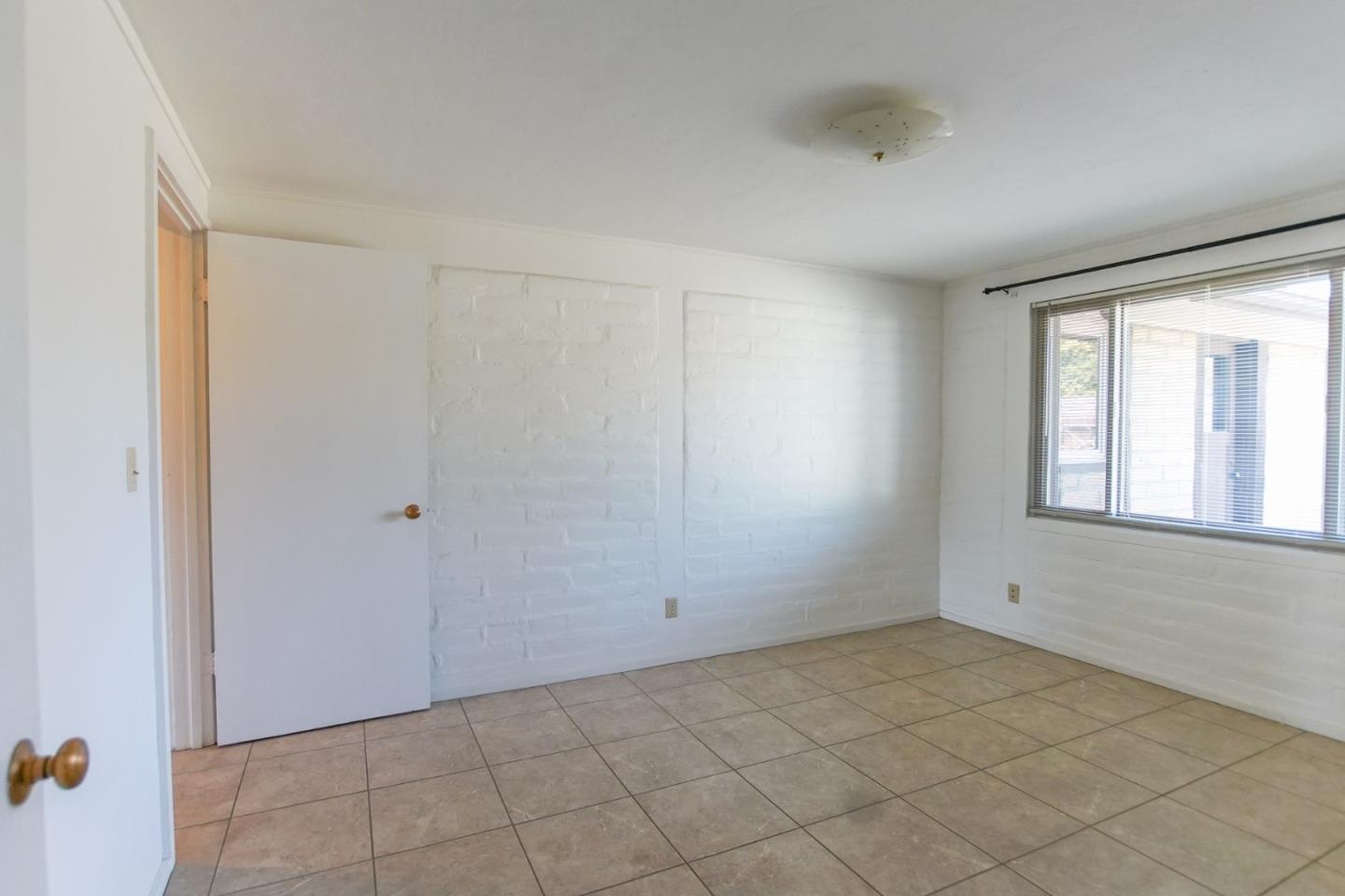 1521 Cienega Road Hollister, CA 95023 - Photo 33 of 56 a view of an empty room with a window