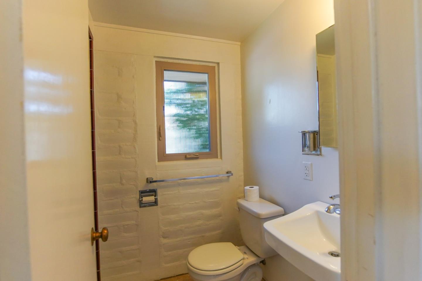 1521 Cienega Road Hollister, CA 95023 - Photo 39 of 56 a white toilet sitting next to a bathroom sink