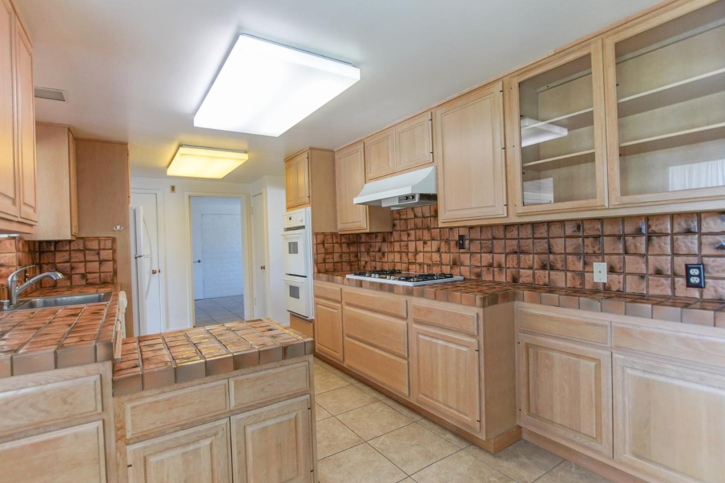 1521 Cienega Road Hollister, CA 95023 - Photo 40 of 56 a bathroom with a sink and a mirror