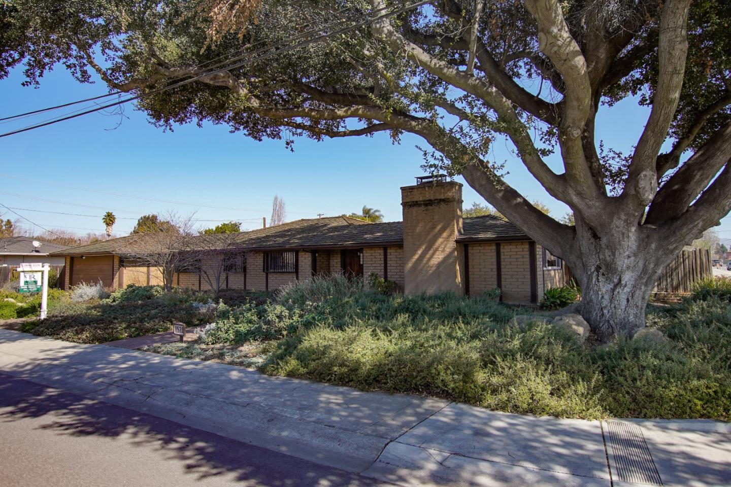 1521 Cienega Road Hollister, CA 95023 - Photo 4 of 56 a house that has a tree in front of it
