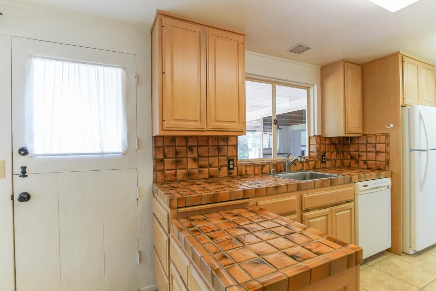 1521 Cienega Road Hollister, CA 95023 - Photo 42 of 56 a kitchen with stainless steel appliances a refrigerator and a window