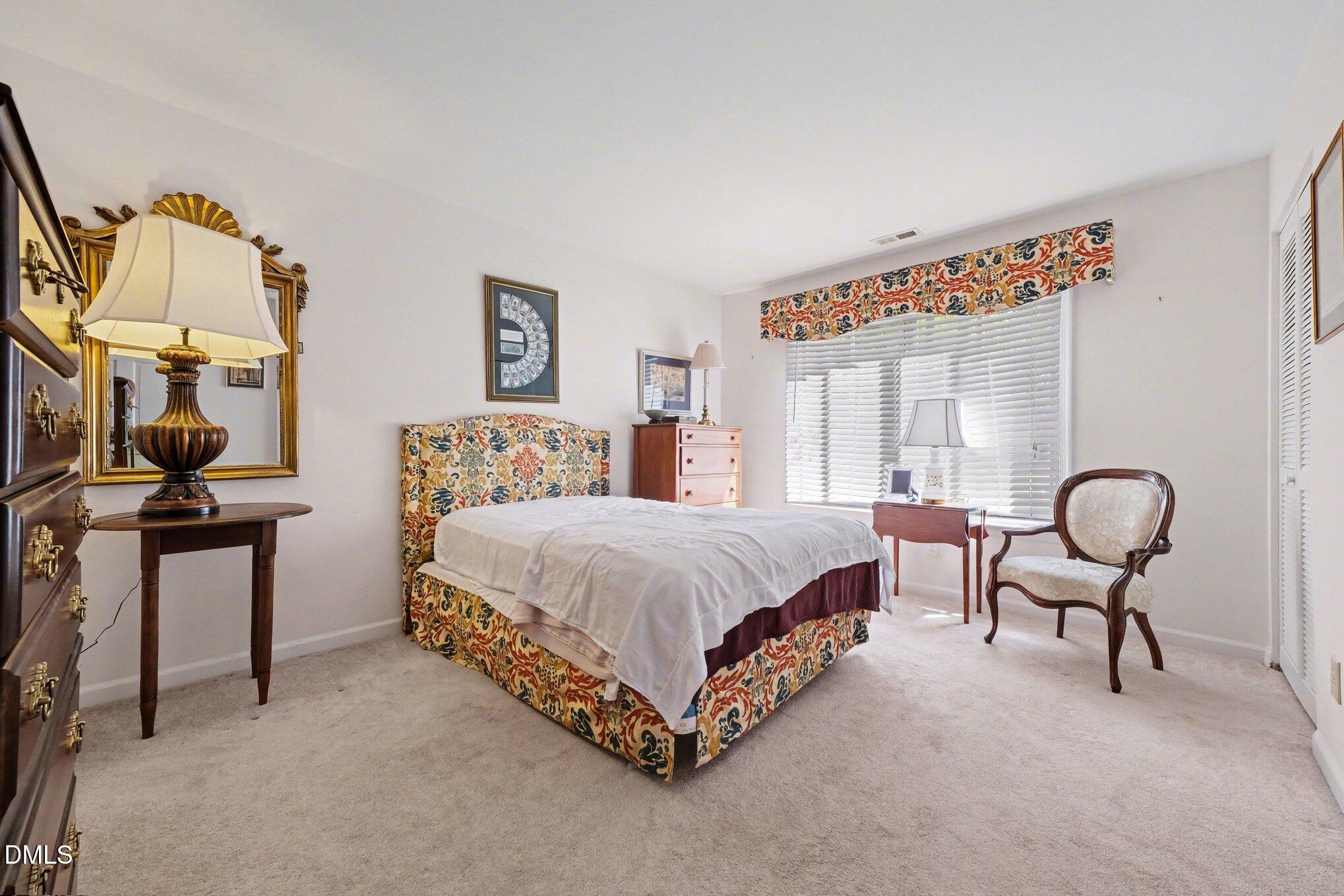1911 Front Street, Unit 3B Durham, NC 27705 - Photo 19 of 33 a spacious bedroom with a bed and window
