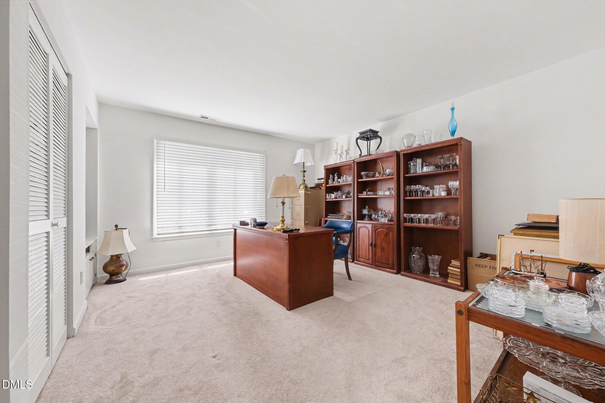 1911 Front Street, Unit 3B Durham, NC 27705 - Photo 20 of 33 a room with furniture and a window
