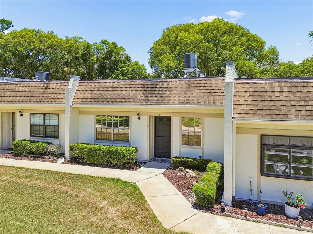 11340 Carriage Hill Drive, Unit 4 Port Richey, FL 34668 - Photo 1 of 36 front view of a house