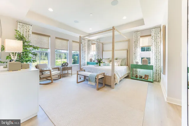 a view of a room that has a bench and a table in it